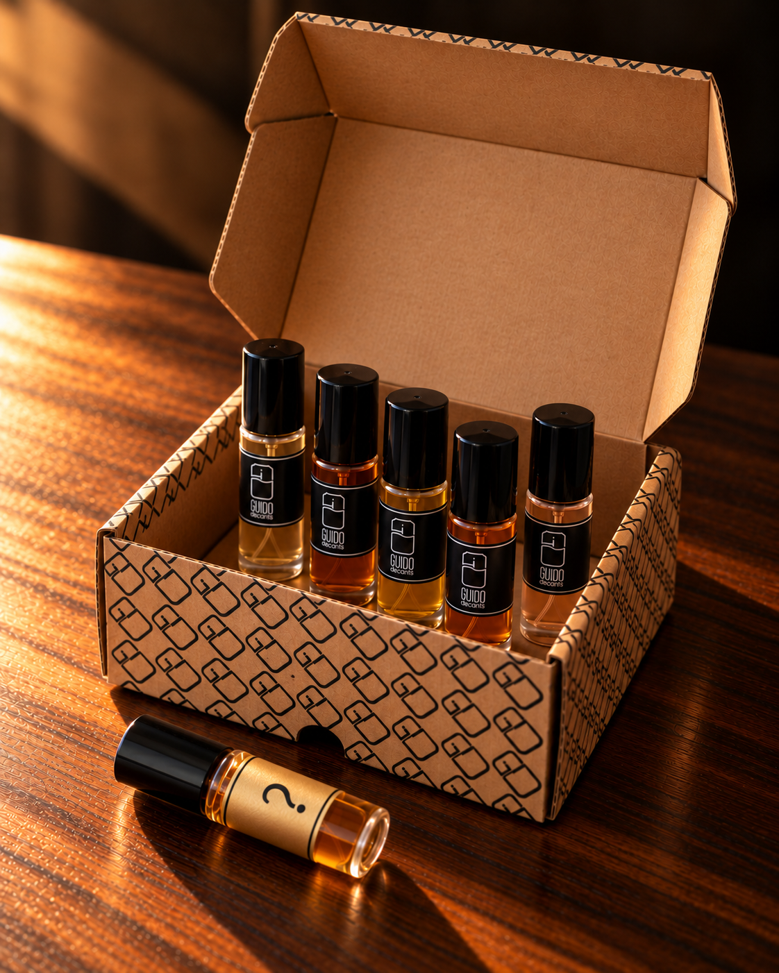 Caixa Guido Decants aberta com cinco decants e um decant surpresa