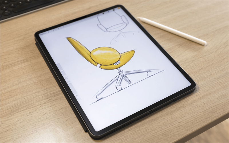 Tablet com o desenho da cadeira Giorgio sobre a mesa do estúdio