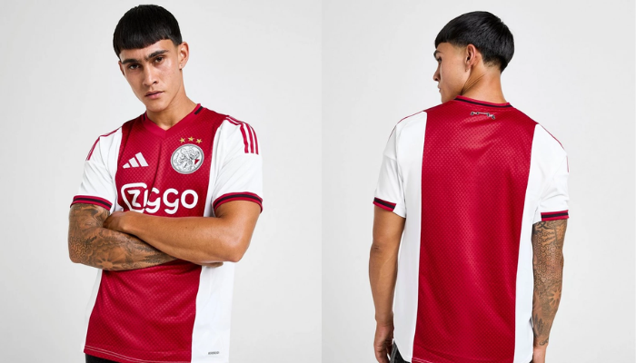 Camisa titular do Ajax 2025/26 Adidas nas cores vermelha, branca e preta com escudo clássico, cruzes de Santo André e detalhes dourados homenageando Amsterdã.