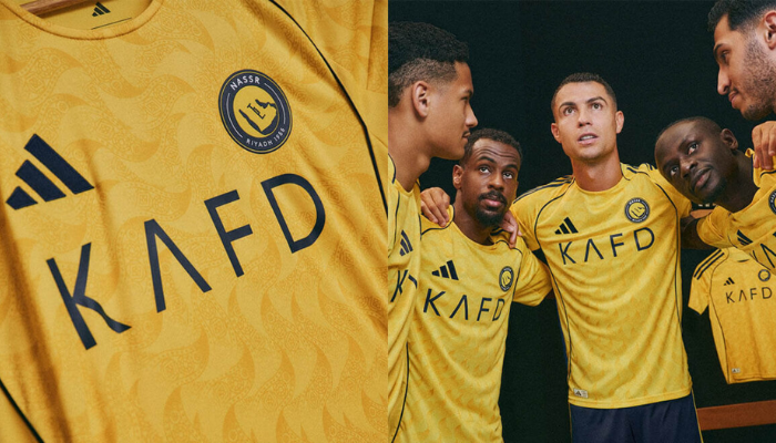 Camisa titular Al-Nassr Adidas 2025/26 amarela com detalhes azul-marinho e novo escudo aplicado no peito.