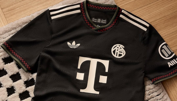 Terceira camisa Bayern de Munique Adidas 2025/26 preta com padrão xadrez, inspirada na Marienplatz.