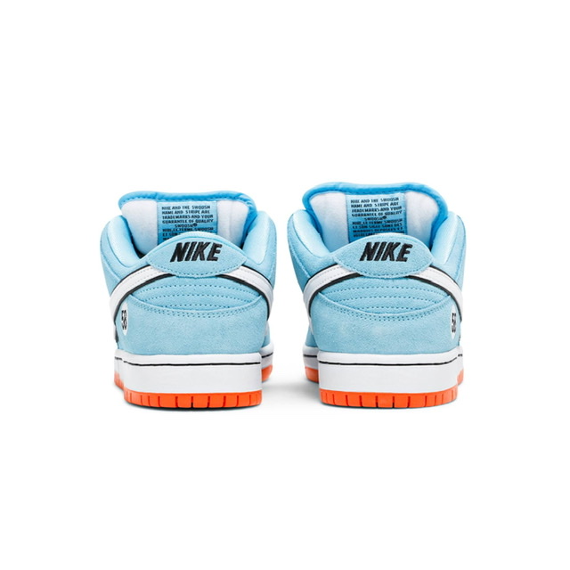 Tênis Nike Dunk Low "Club 58 Gulf" na cor azul com detalhes em laranja e logotipo da Nike, disponível na Supernova Sneakers.