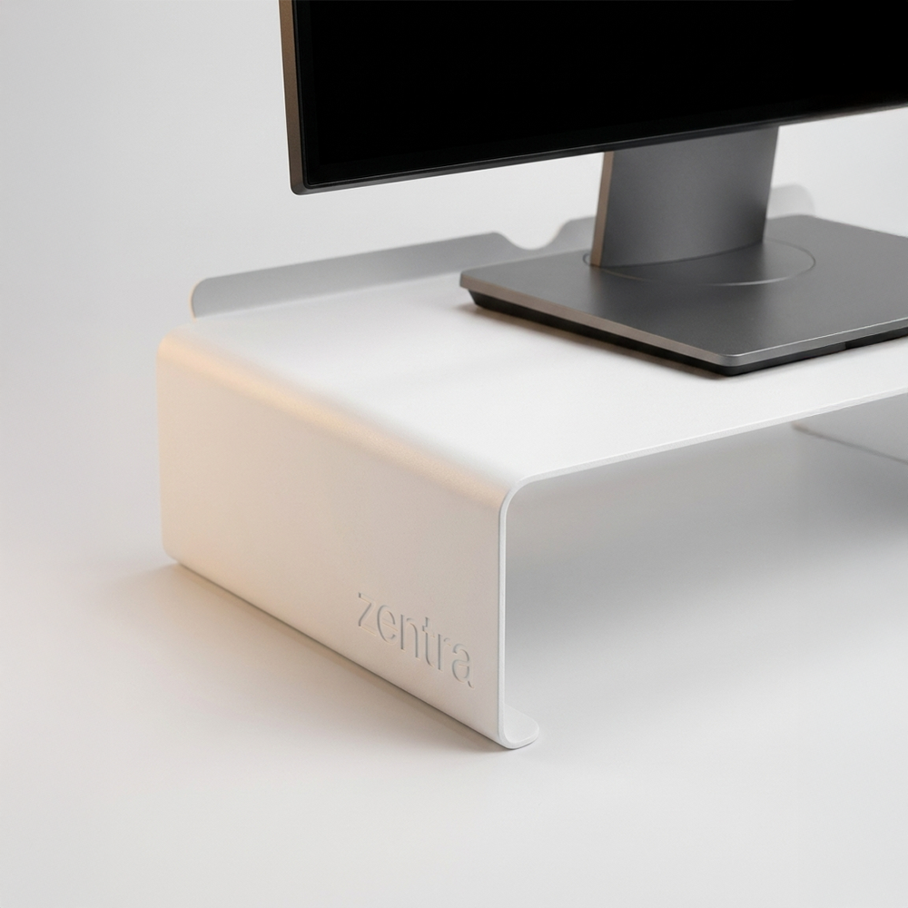 Estante para monitor disponible en blanco, gris plomo y negro