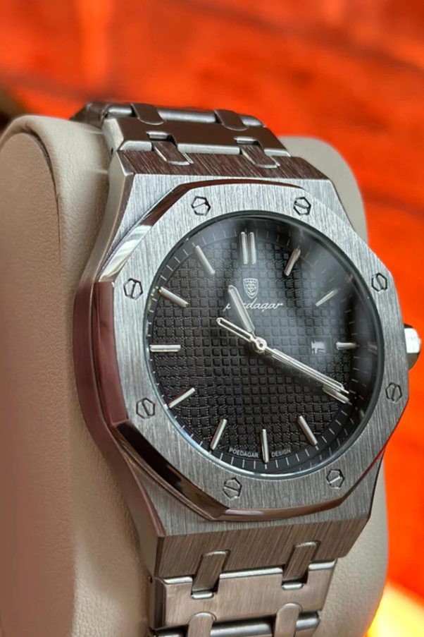 A silver watch on a stand

AI-generated content may be incorrect.