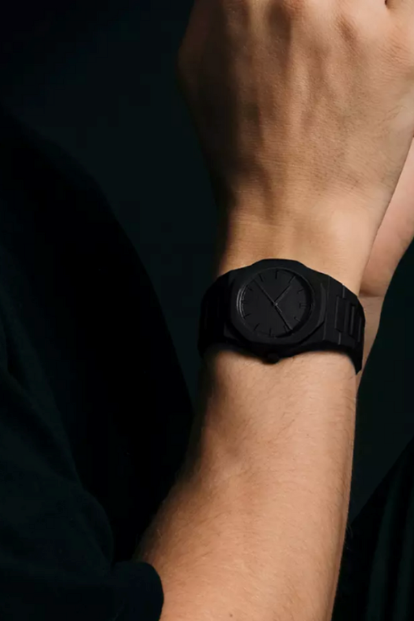 A person wearing a black watch

AI-generated content may be incorrect.