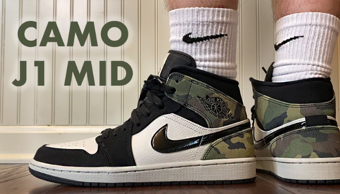 Air Jordan 1 Mid SE GS Camo com estampa camuflada em tons neutros e detalhes em nobuck preto.