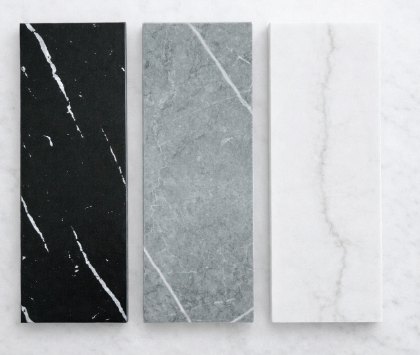 Muestras de superficie ultra compacta en negro, gris y blanco