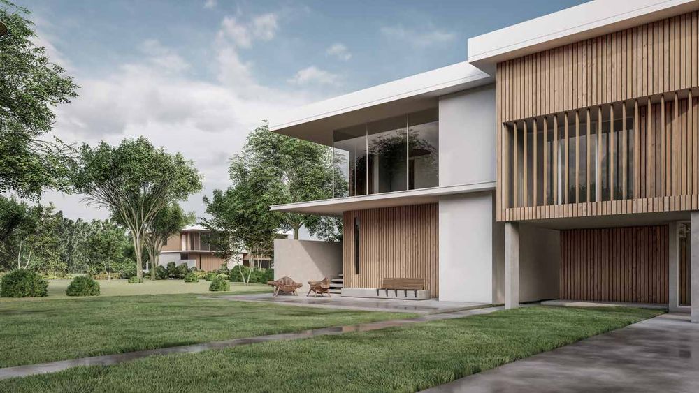 Casa moderna con la fachada revestida en columnas WPC símil madera colocadas en vertical