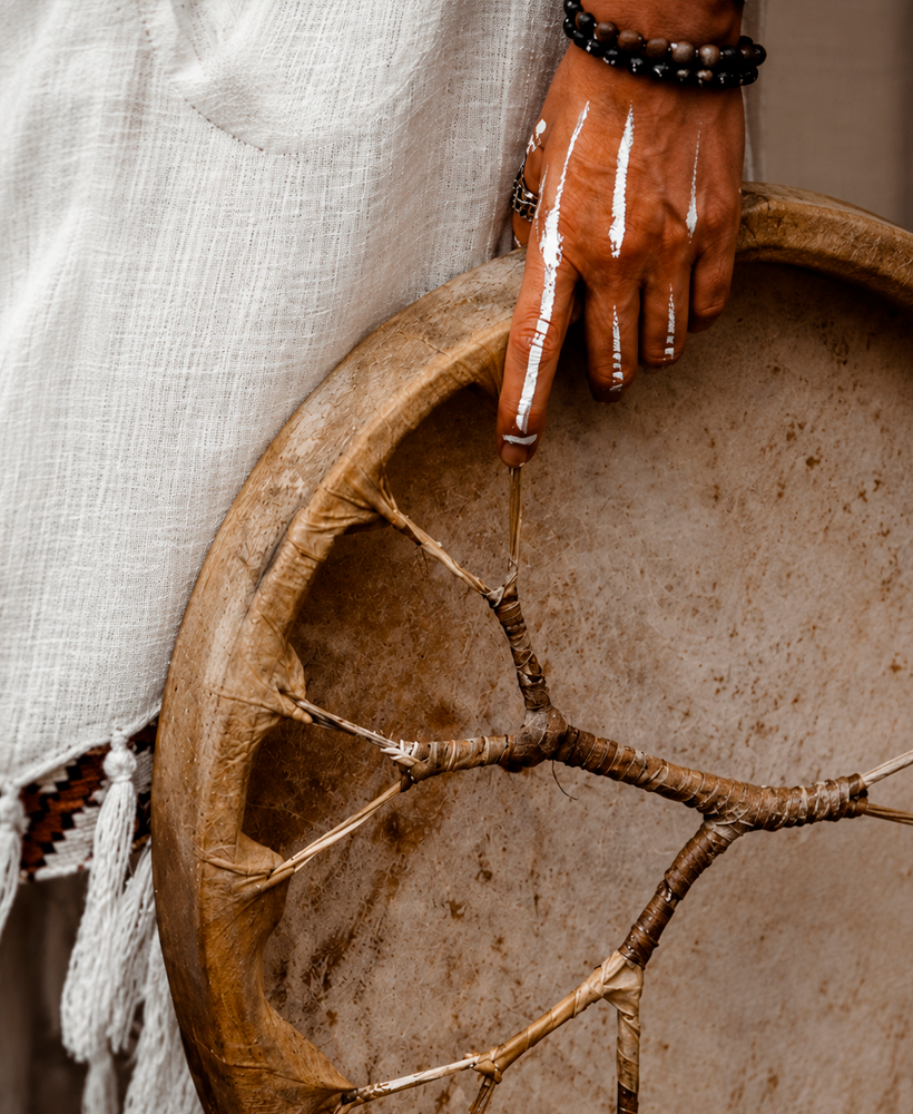 Ancestral drum held against handwoven cloth